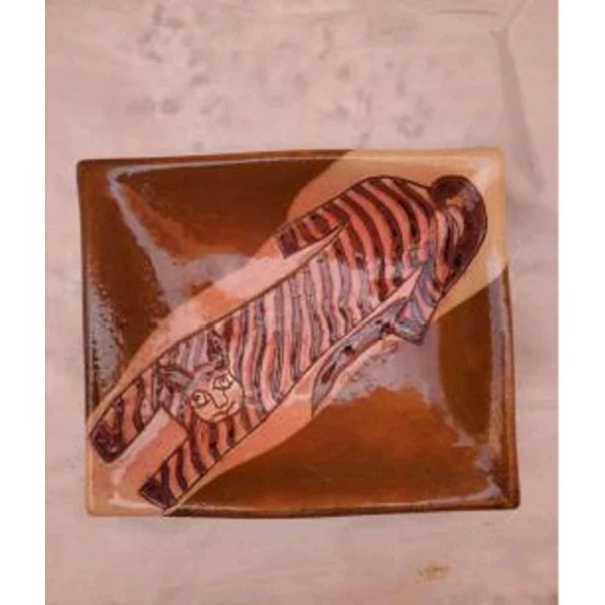 brown and earth-toned lusterware square dish