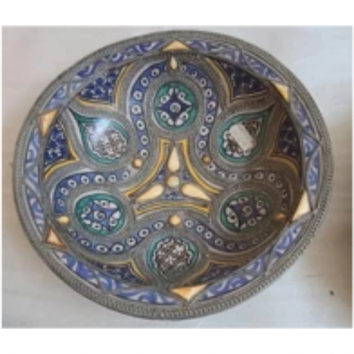 Large white metal-mounted  ceramic plate