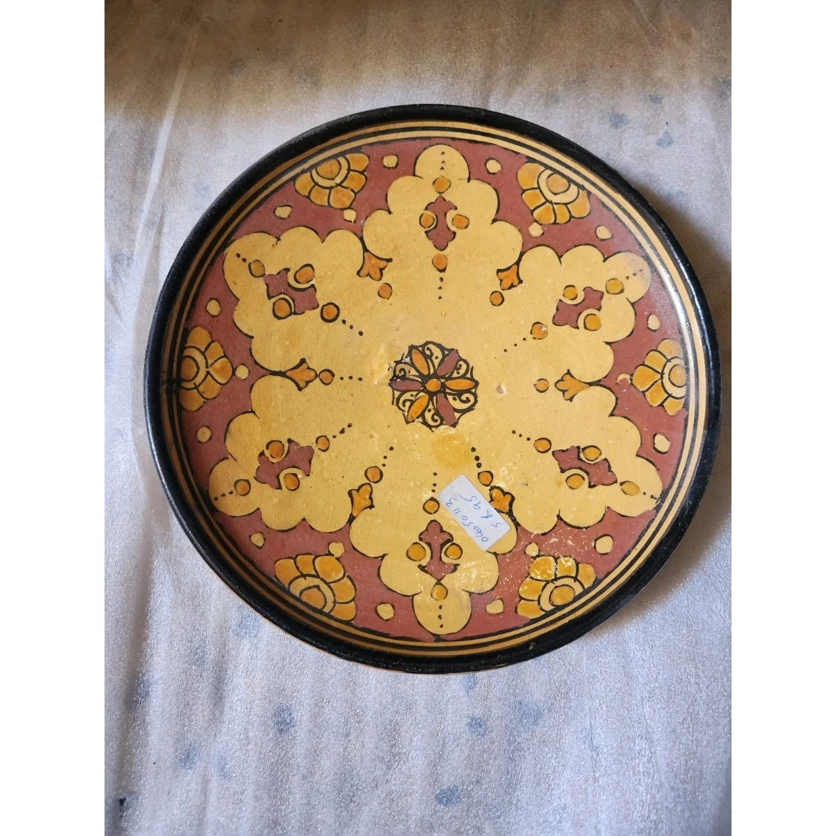 red and yellow ceramic dish
