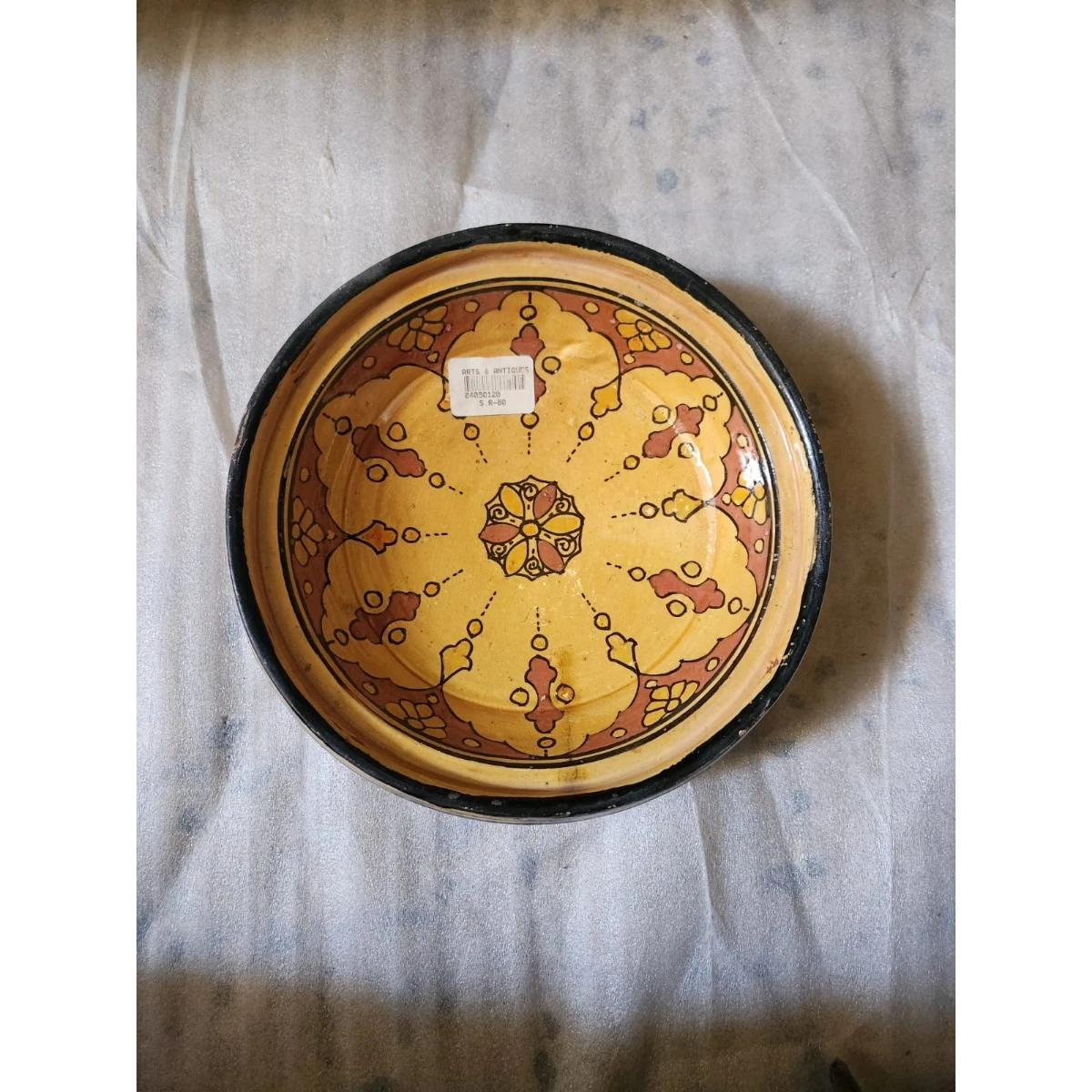 red and yellow ceramic dish