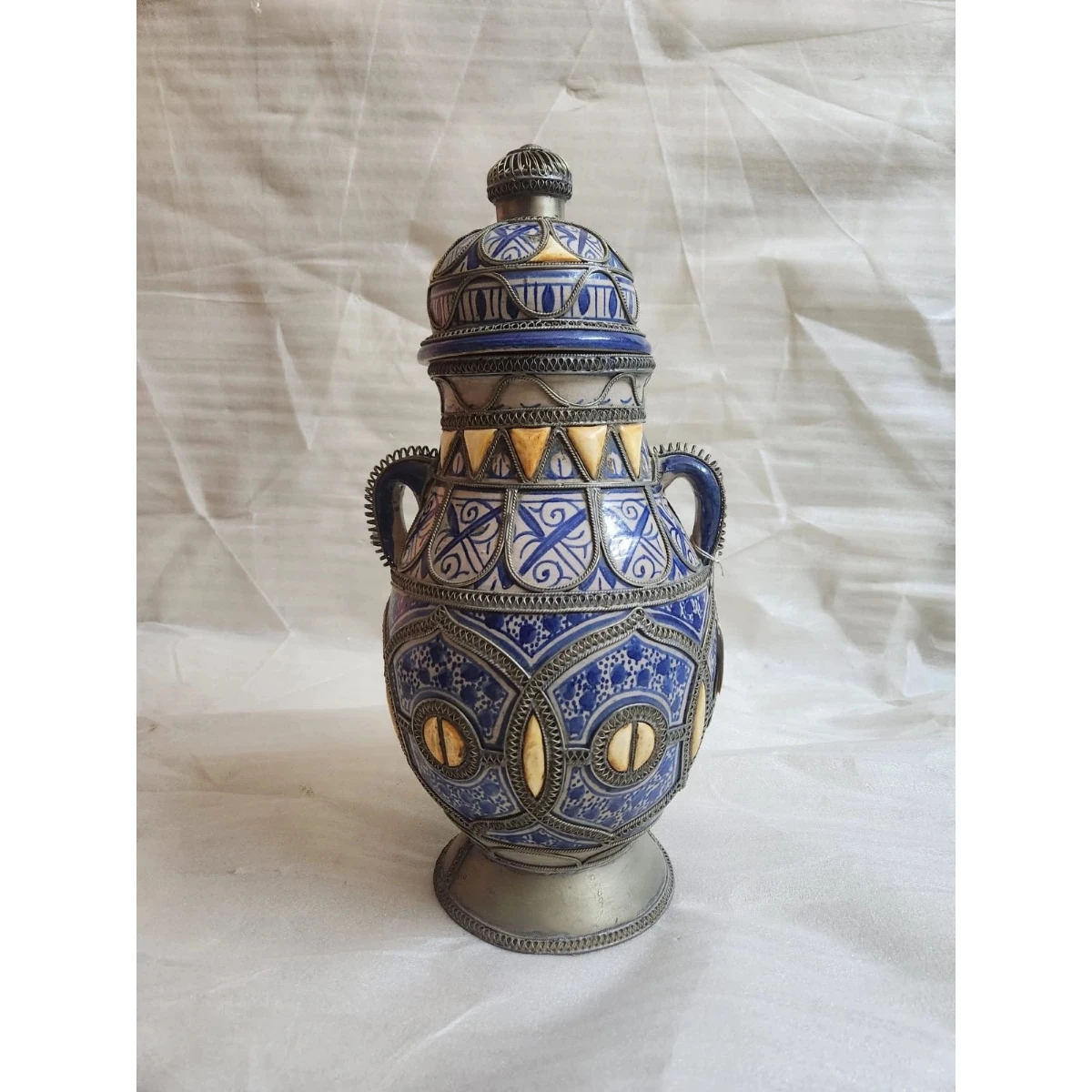 Large metal-mounted ceramic vase with lid
