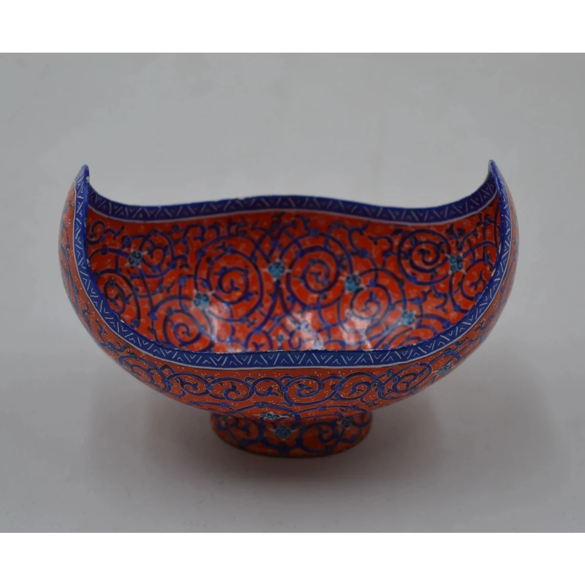 Footed bowl with upturned sides